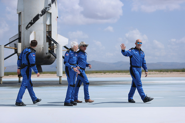 VAN HORN, TEXAS - JULY 20: Blue Origin’s New Shepard crew (L-R) Oliver Daemen, Wally Funk, Jeff Bezos, and Mark Bezos walk near the ship after flying into space on July 20, 2021 in Van Horn, Texas. Mr. Bezos and the crew that flew with him were the first human spaceflight for the company. (Photo by Joe Raedle/Getty Images)