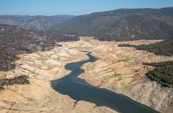 OROVILLE, CA - SEPTEMBER 1: Lake Oroville, California's second largest water reservoir (2,359,720 acre-feet), fed by the Feather River, is at 23% capacity and at historically low levels impacting hydroelectric power, tourism and agriculture as viewed on September 1, 2021, near Oroville, California. Lake Oroville is a key source for collecting and delivering large amounts of water through the Central Valley and into the Sacramento River Delta where the California State Water Project (aka California Aqueduct) begins, moving water to Southern California and all regions in between. (Photo by George Rose/Getty Images)